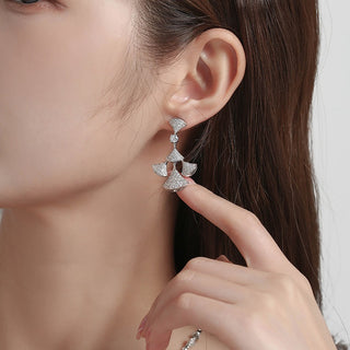 Sterling silver cascade earrings feature an elegant cascading design with sparkling zirconia stones.