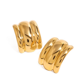 Pair of gold hoop earrings on a white background